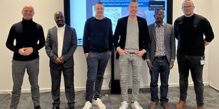 Gemeinsames Foto aller Referenten, im Hintergrund ist der Präsentationsbildschirm